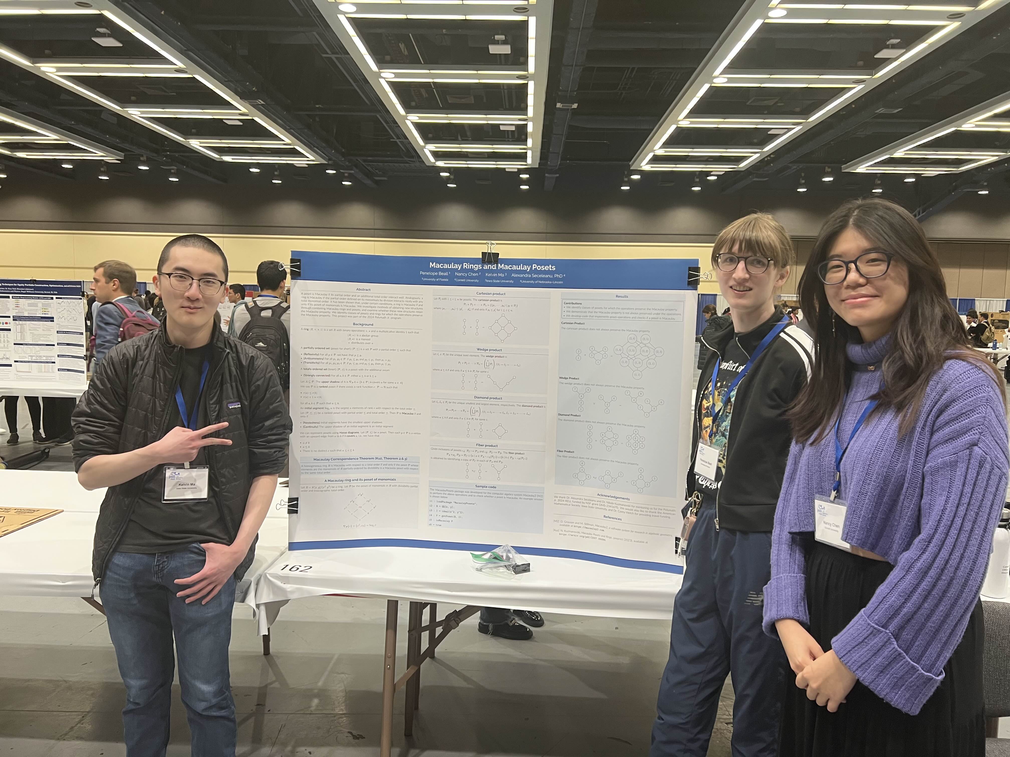 a poster titled "Macaulay Rings and Macaulay Posets," surrounded by three people looking at the camera
